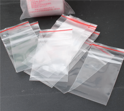 Miksi vetoketjupussin suussa on punainen viiva?